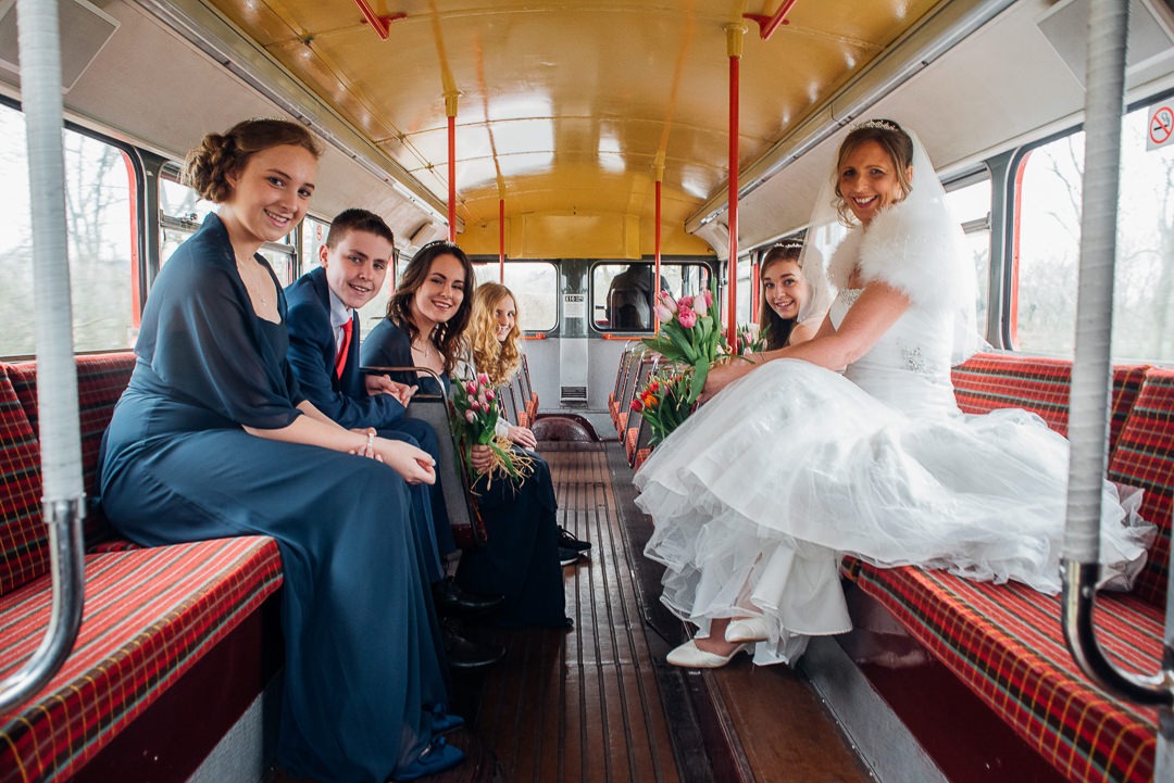 Group Portrait of Bridal Party inside of the bridal carriage - Red Bus