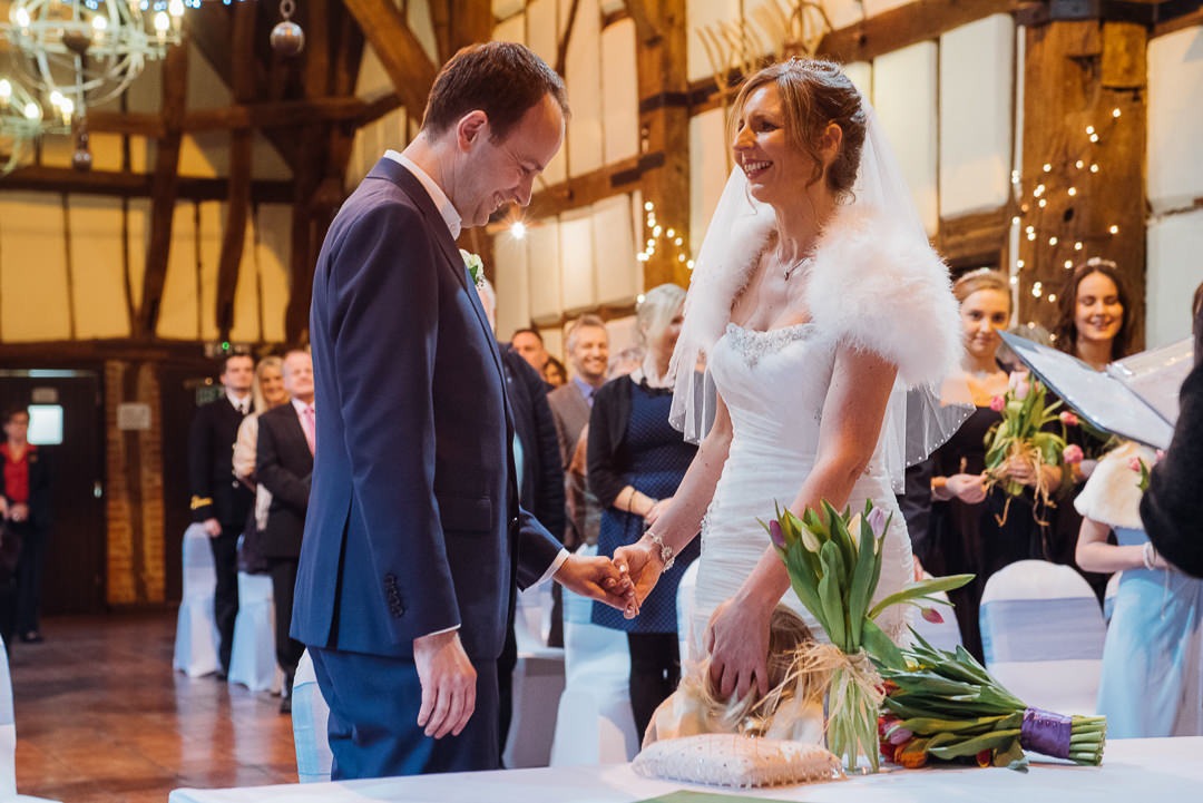 Bride and Groom Exchanging Vows at the Tithe Barn, Bedford.