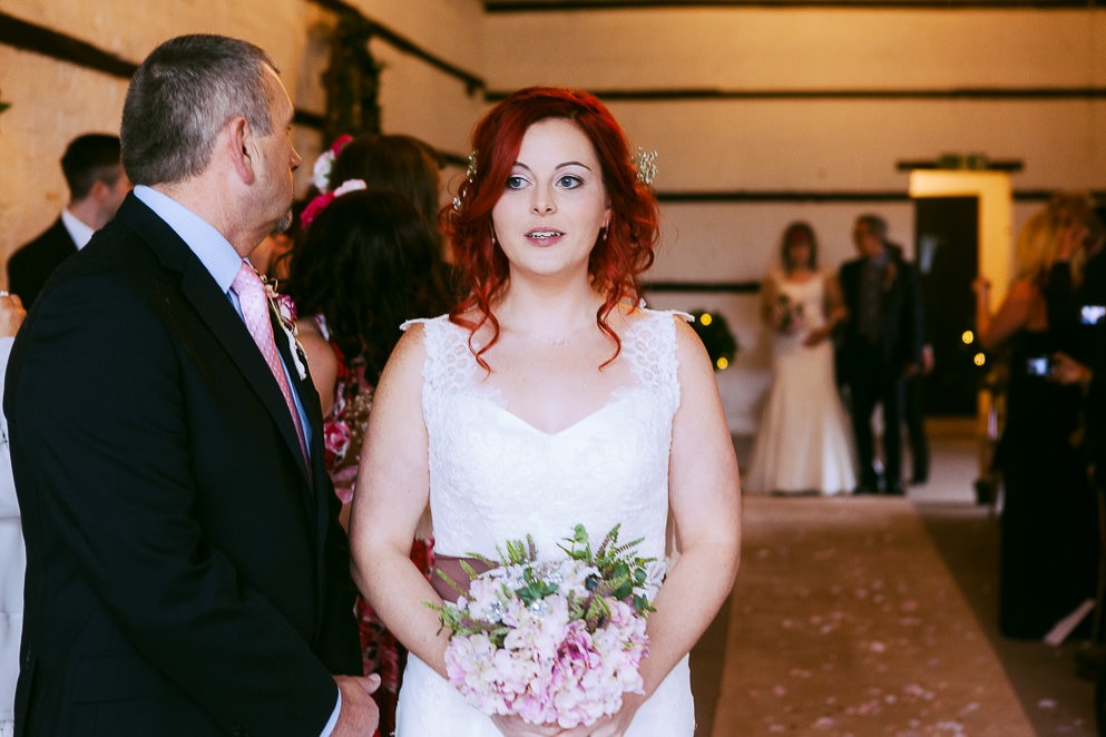 Bride approaches at LGBTQ+ Wedding