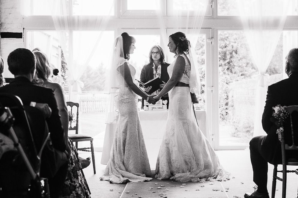 Brides exchanging vows at LGBTQ+ Wedding